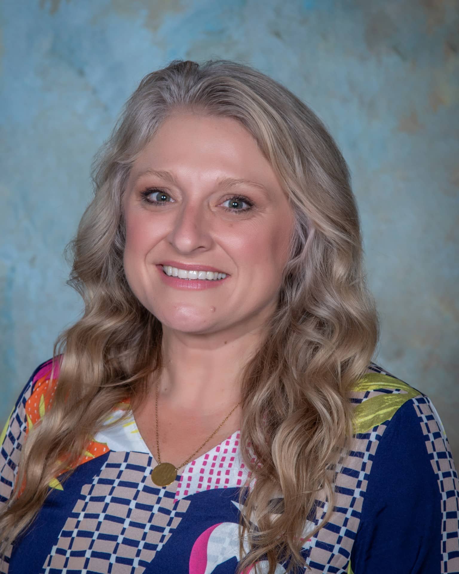 a woman smiling for the camera