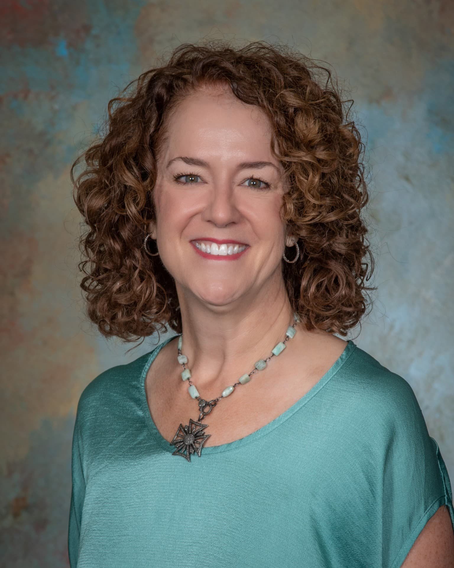 a woman smiling for the camera