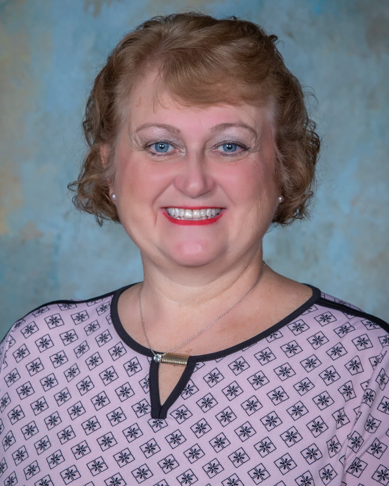 a woman smiling for the camera