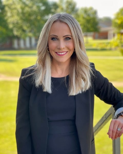 A Woman Smiling For The Camera