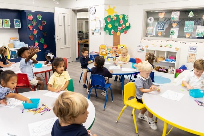 a group of people sitting at a table in a room