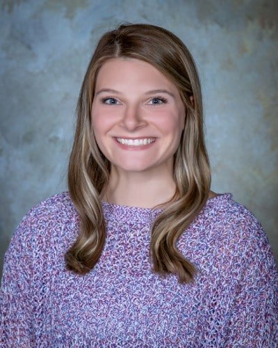 a woman smiling for the camera